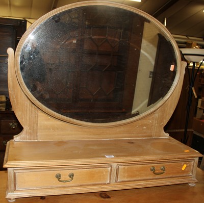 Lot 1459 - An early 20th century pine oval bevelled swing...
