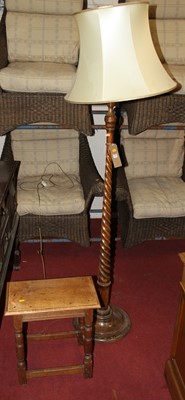 Lot 1466 - An early 20th century turned walnut standard...