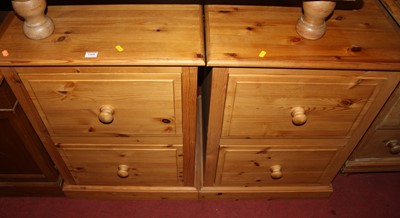Lot 1468 - A pair of pine low two drawer office filing...