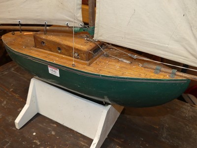 Lot 1542 - A wooden kit built model pond yacht with...