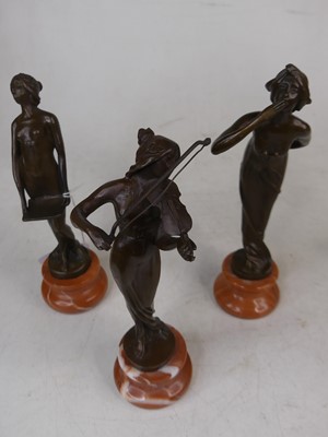 Lot 24 - A set of three reproduction bronze figures of...