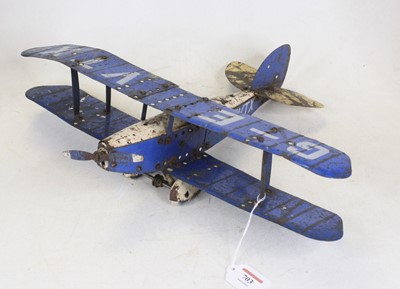 Lot 703 - A vintage tinplate model bi-plane, w.46cm