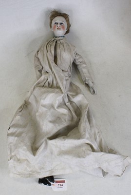Lot 714 - A vintage bisque porcelain headed doll, having...