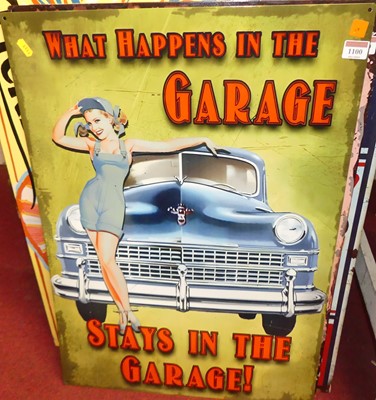 Lot 1100 - A printed tin sign 'What happens in the garage,...