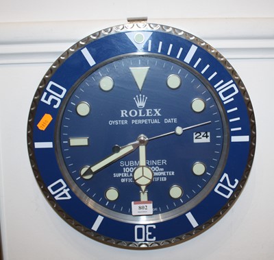 Lot 802 - A modern brushed aluminium wall clock in the...