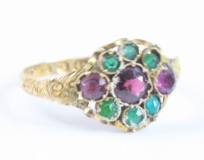 Lot 2626 - A 12ct yellow gold, garnet and emerald...