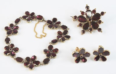 Lot 2628 - A yellow metal garnet suite, featuring a...