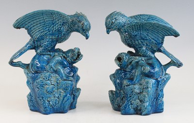 Lot 2273 - A pair of Chinese blue glazed models of birds...