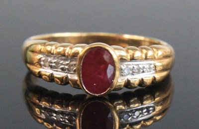 Lot 2670 - A modern 9ct gold, ruby and diamond dress ring,...