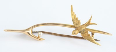Lot 2671 - An Edwardian 15ct gold wishbone brooch, set...