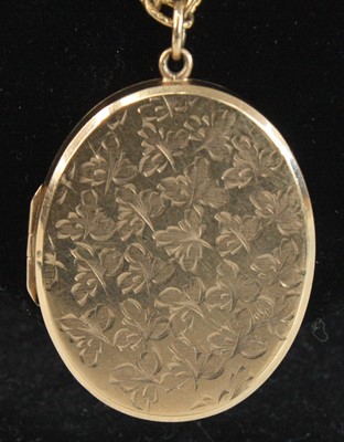 Lot 2686 - A modern 9ct gold picture locket, of oval form,...