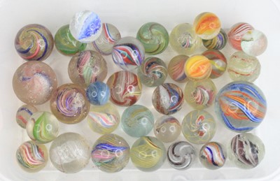 Lot 4110 - A collection of glass marbles, 19th century,...