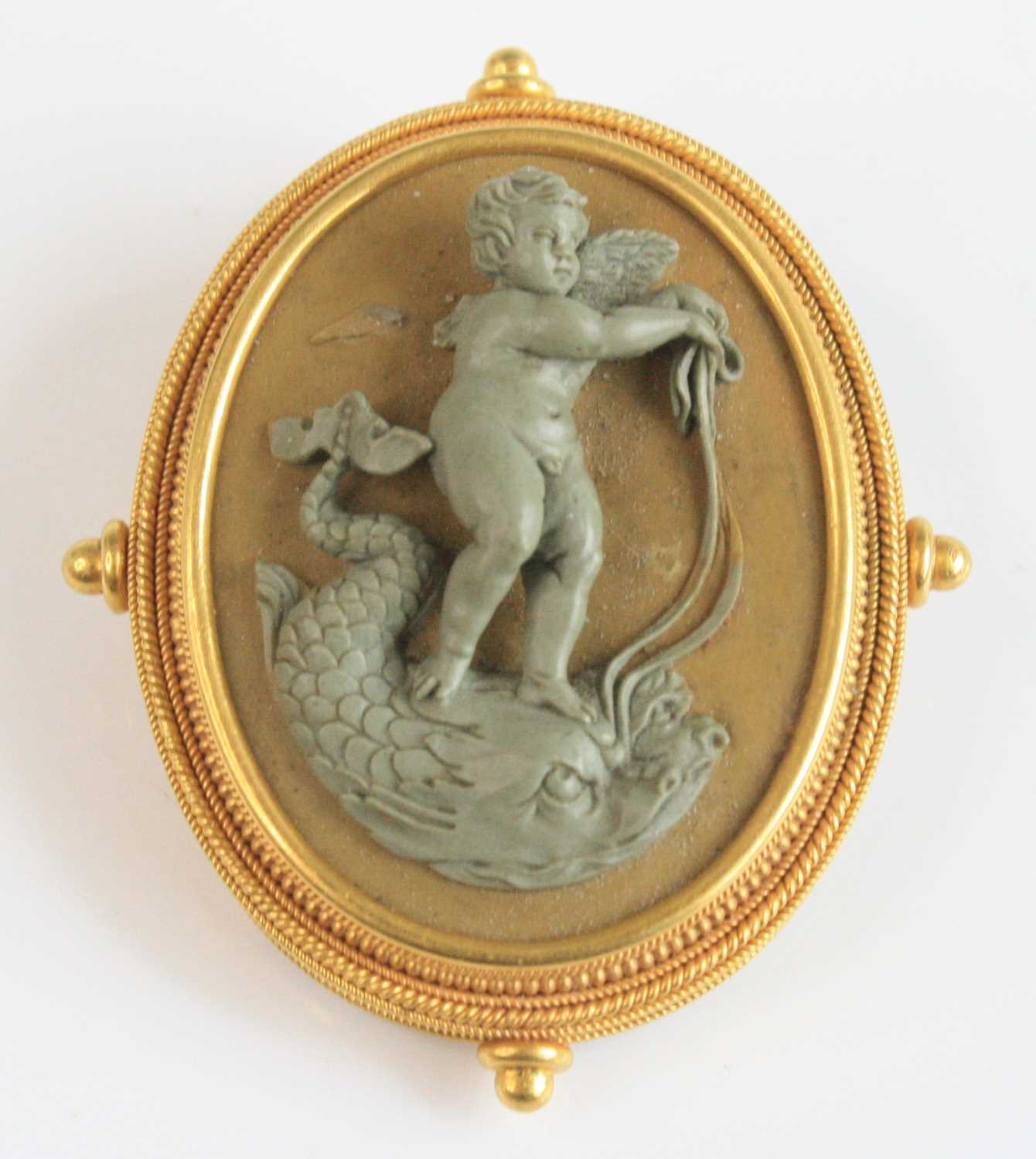 Lot 2785 - A yellow metal lava cameo brooch depicting a...