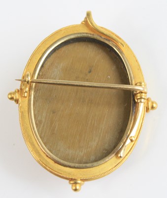 Lot 2785 - A yellow metal lava cameo brooch depicting a...