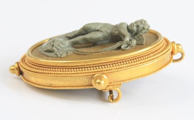 Lot 2785 - A yellow metal lava cameo brooch depicting a...
