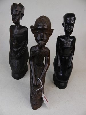 Lot 8 - A matched set of three African carved hardwood...