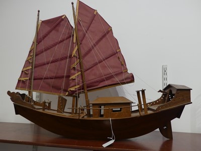 Lot 23 - A hardwood model of a Chinese junk boat,...