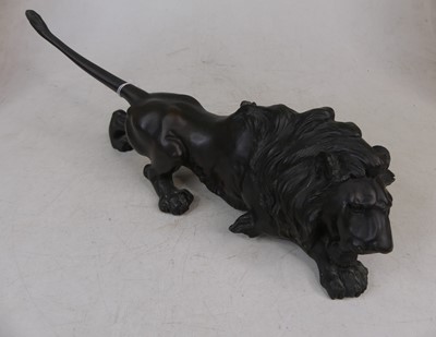 Lot 46 - A Japanese bronze model of a lion, seal mark...