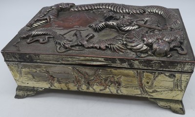 Lot 54 - A Japanese plated copper box, relief decorated...