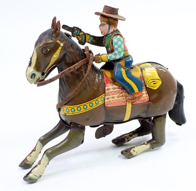 Lot 1566 - A Haji Toys of Japan tinplate and clockwork...