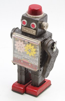 Lot 1727 - An SH Toys of Japan tinplate and clockwork...