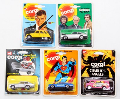 Lot 1265 - A collection of five various carded Corgi...