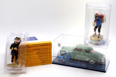 Lot 1696 - A small collection of Tin Tin models and books...