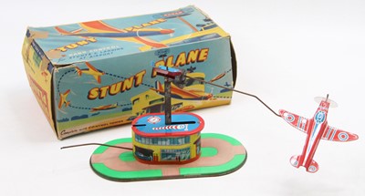 Lot 1626 - A Radar Toys tinplate clockwork Stunt Plane...