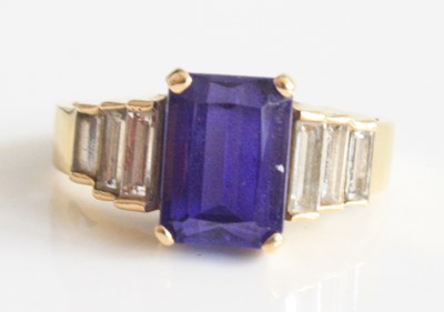 Lot 2185 - A yellow metal, tanzanite and diamond...