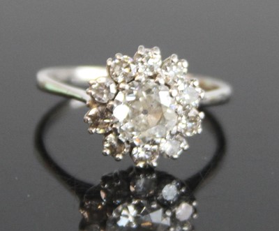 Lot 2187 - A white metal diamond circular cluster...