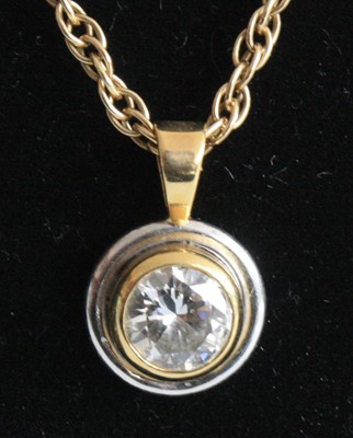 Lot 2196 - A yellow and white metal diamond single stone...