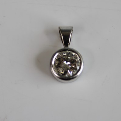 Lot 2195 - A white metal diamond single stone pendant,...