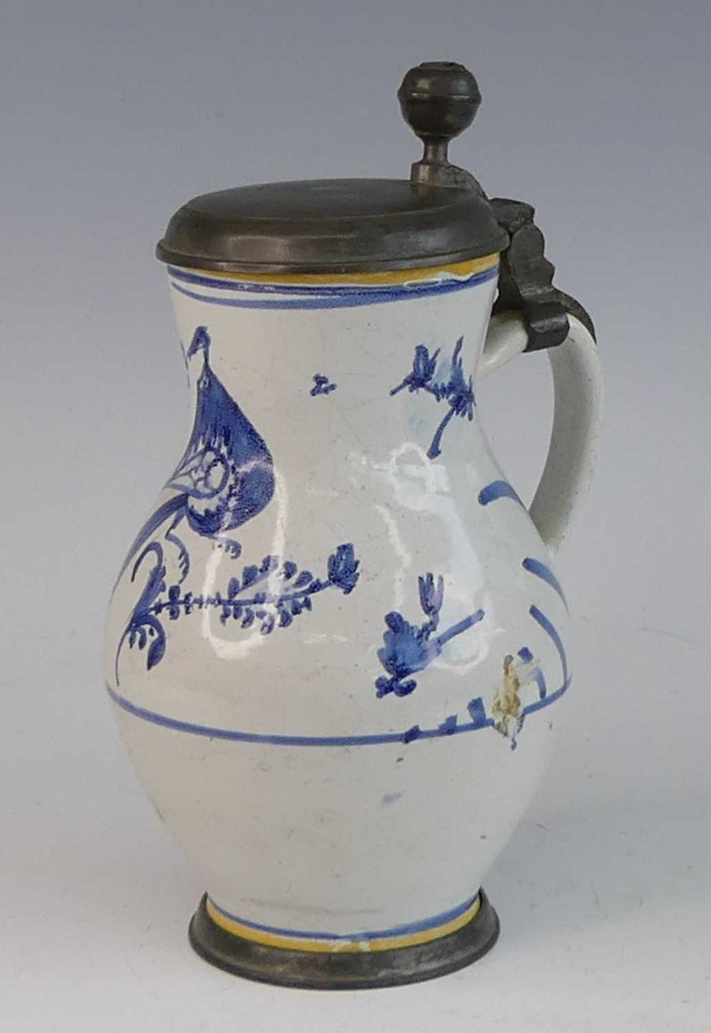 Lot 2046 - A Delft jug, 18th century, having a pewter lid...