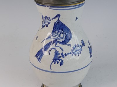 Lot 2046 - A Delft jug, 18th century, having a pewter lid...