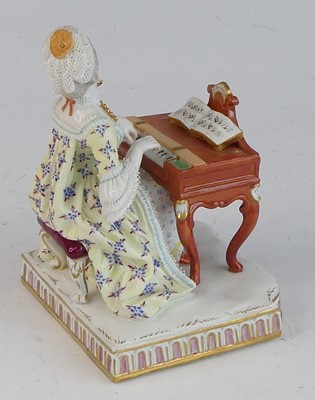 Lot 2058 - A Meissen porcelain figure of a lady, late...