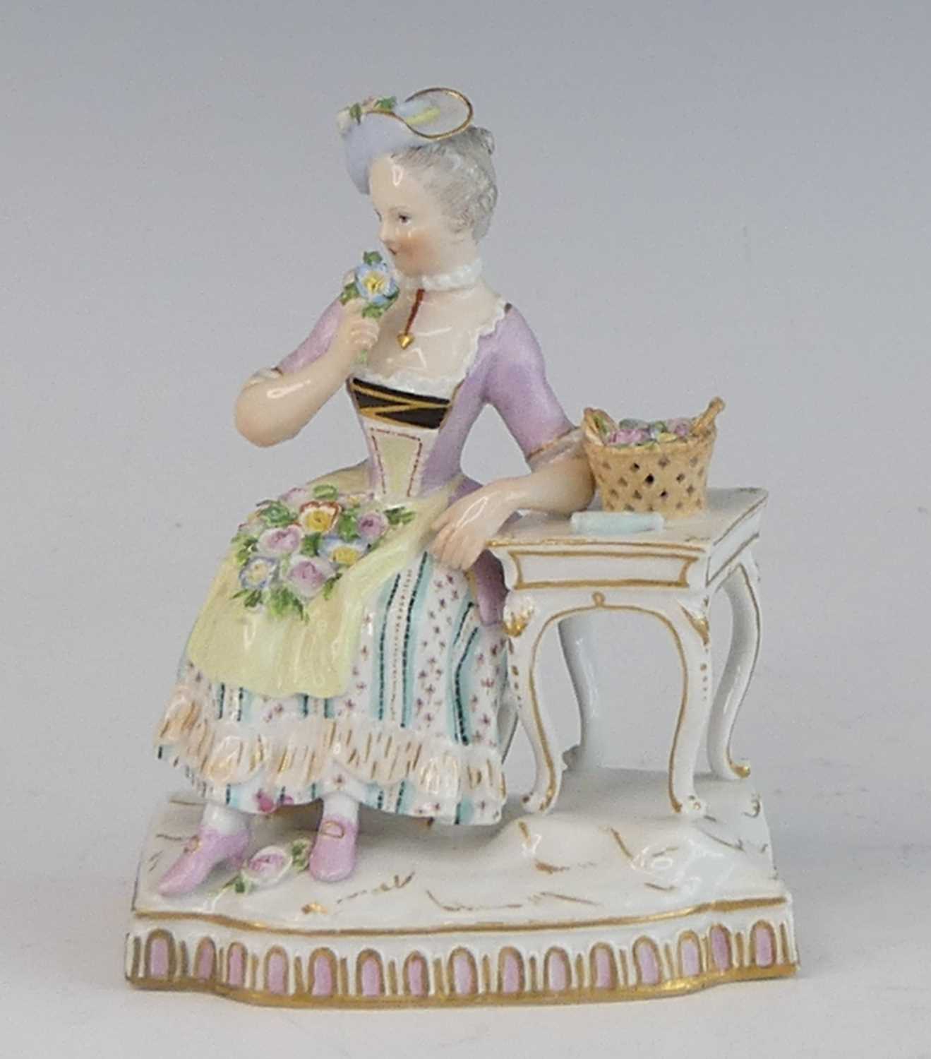 Lot 2055 - A Meissen porcelain figure of a lady, late...