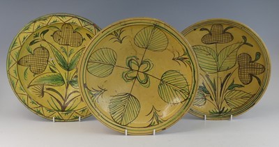 Lot 2043 - A matched pair of middle eastern slip glazed...