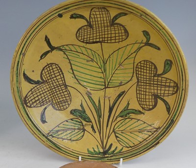 Lot 2043 - A matched pair of middle eastern slip glazed...