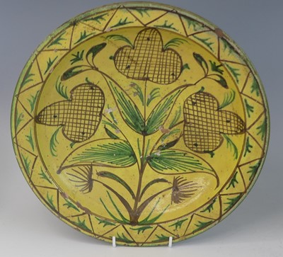 Lot 2043 - A matched pair of middle eastern slip glazed...