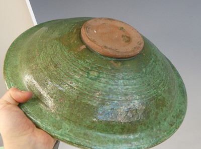 Lot 2043 - A matched pair of middle eastern slip glazed...