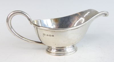 Lot 89 - An Art Deco silver footed sauceboat, with...