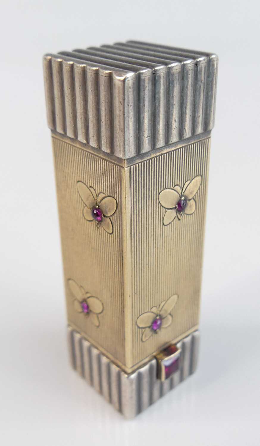 Lot 95 - A French Art Deco white and gilt metal...