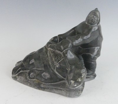 Lot 142 - Inuit Art - a carved and polished variegated...