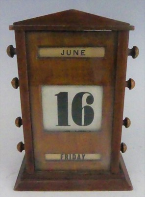 Lot 126 - An Art Deco mahogany desk calendar, with...