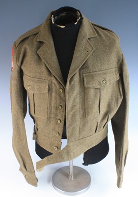 Lot 738 - A post WW II 1949 pattern battle dress blouse,...