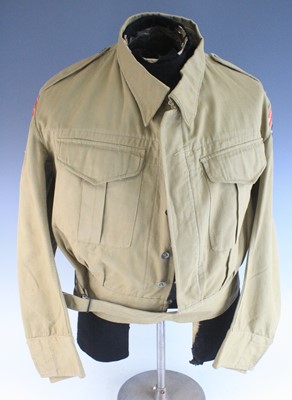 Lot 746 - A WW II tropical battle dress blouse with...