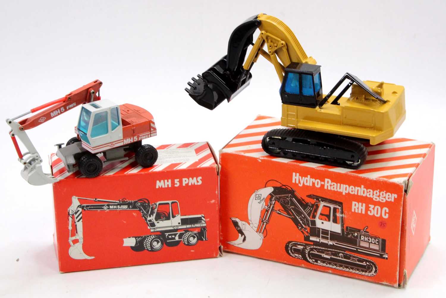 Lot 1024 - An NZG 1/50 scale boxed O&K earth moving...