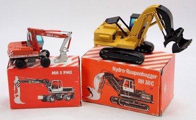 Lot 1024 - An NZG 1/50 scale boxed O&K earth moving...