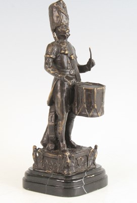 Lot 518 - A bronze alloy figure, modelled as a...