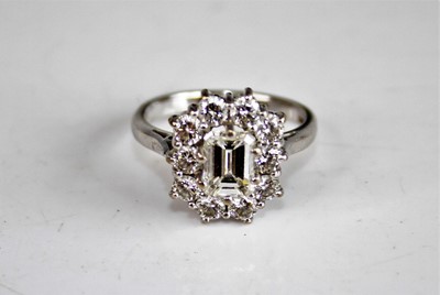 Lot 2194 - A white metal diamond rectangular cluster ring,...